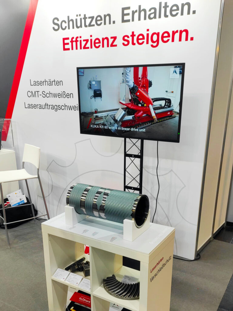 Exhibition stand with laser hardened sample component